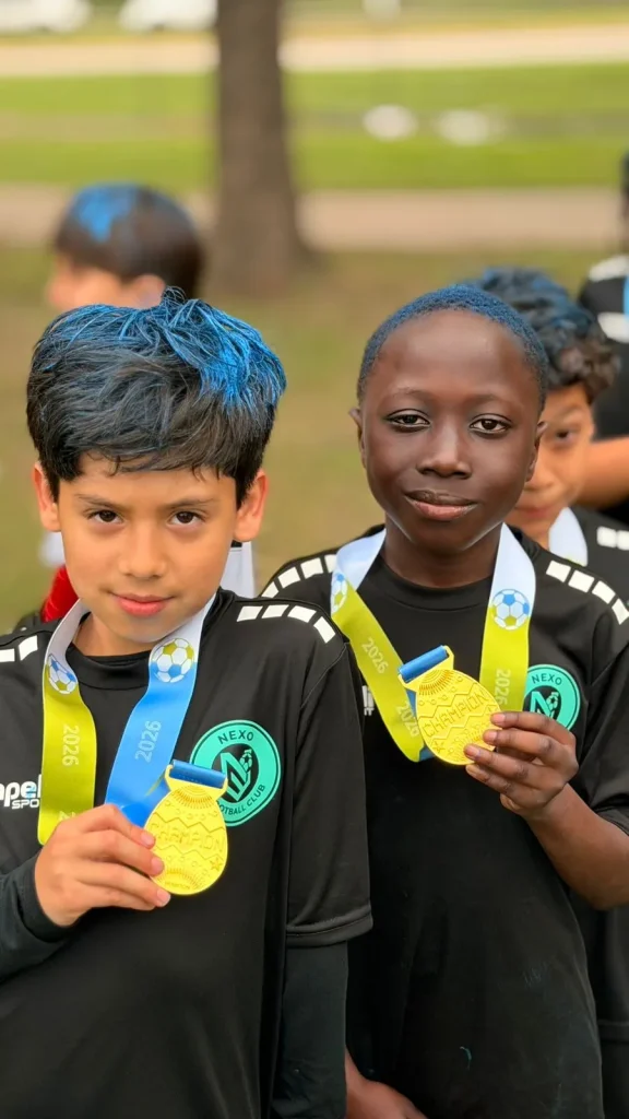 NEXO players showing their medals